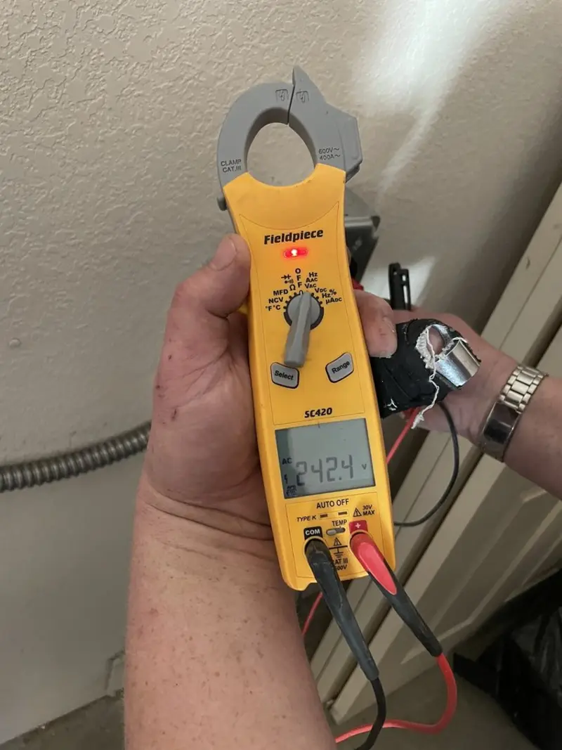 Voltage testing with clamp meter during Outlet Installation in Fayette